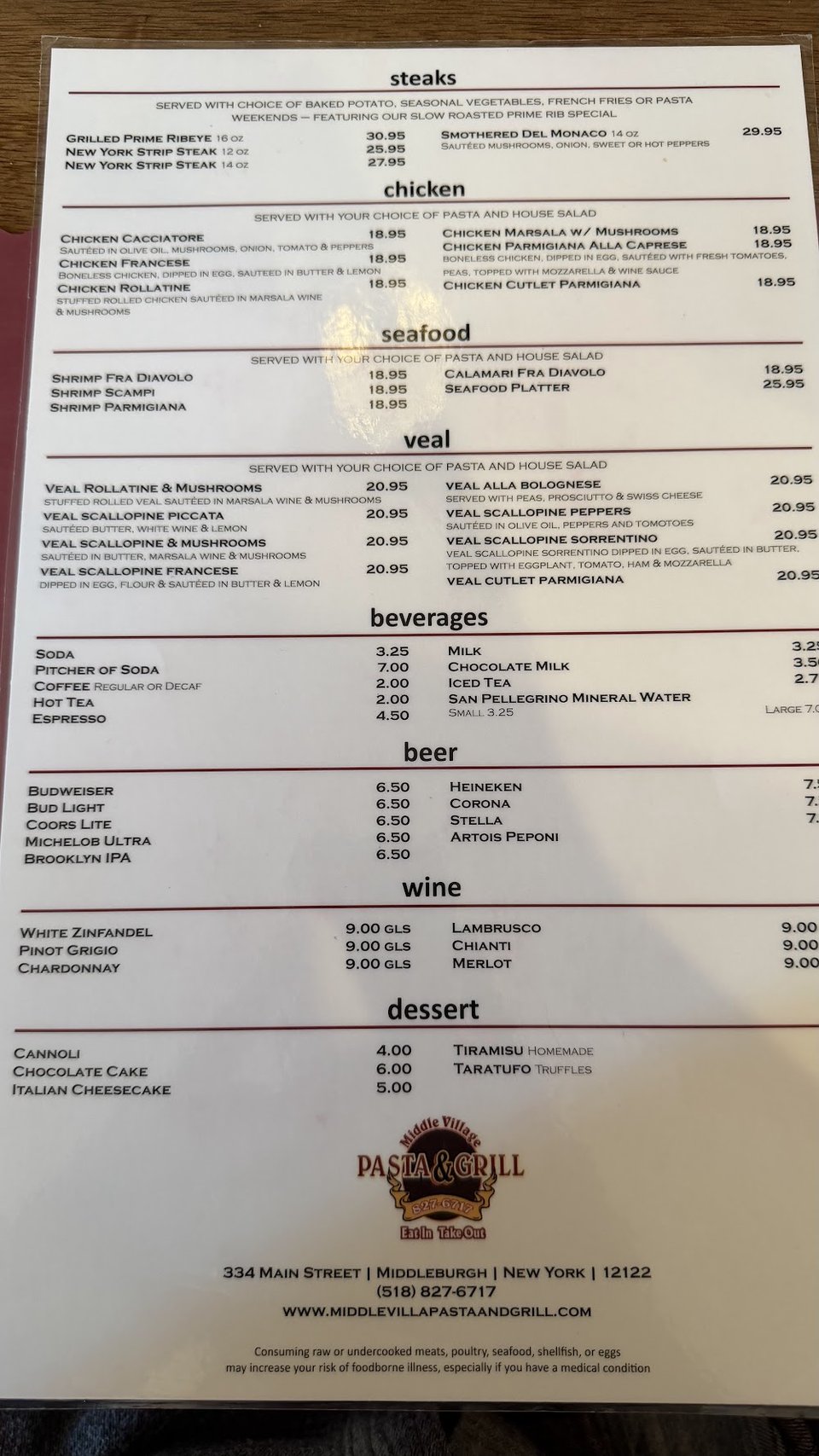 Printed menu with Italian dishes and house wine.